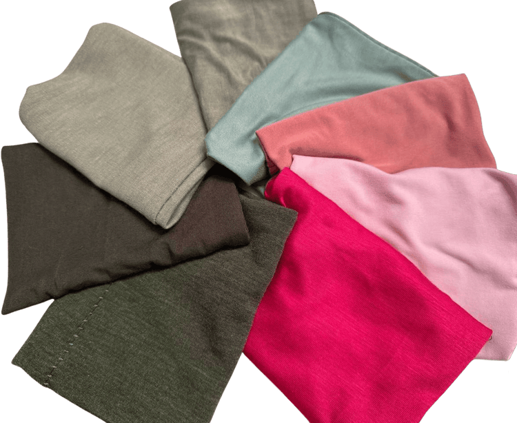 Folded pod bands in olive, sage, coral, hot pink, light pink and taupe, laid flat