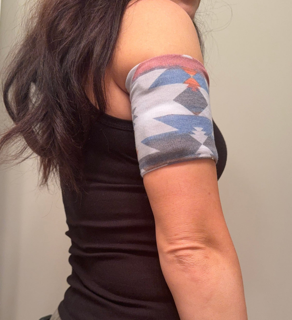 Cozy pod band in Southwest Print worn on the upper arm over a pod